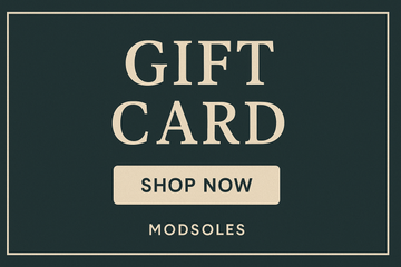 ModSoles digital gift card with cream text on dark teal background featuring ‘Gift Card’ and ‘Shop Now’ button