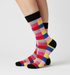 Nightfall Mosaic crew socks flat lay showing deep dark geometric mosaic pattern