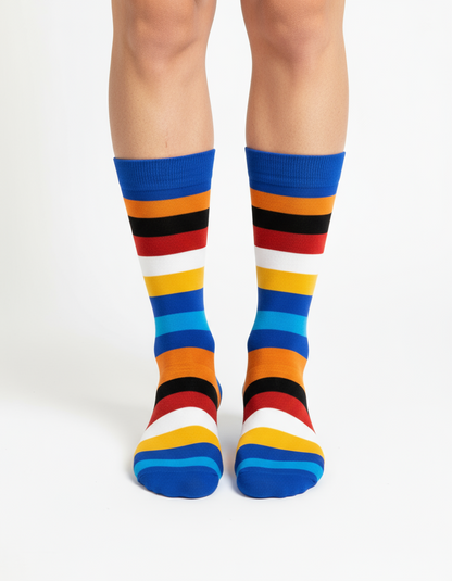 Ocean Burst crew socks flat lay showing blue, orange, and white stripe pattern