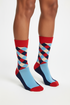 Retro Riot crew socks flat lay showing red, blue, and navy argyle in retro vintage palette