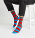 Urban Chic crew socks flat lay showing red and navy stripe pattern with clean city-inspired edge